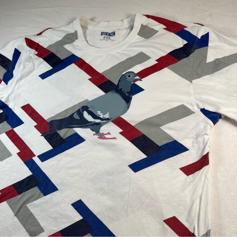 Staple White T‑Shirt with Pigeon Graphic and Red, Blue, Gray Accents